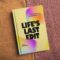 Lifes Last Edit book on table